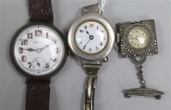 An early 20th century silver manual wind wrist watch in Rolex case and two wrist watches.
